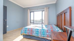 Inviting four bedroom three bathroom family gem with spacious yard in peaceful security estate. - M128761