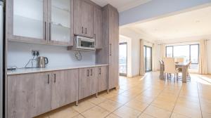 Inviting four bedroom three bathroom family gem with spacious yard in peaceful security estate. - M128761