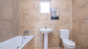 Inviting four bedroom three bathroom family gem with spacious yard in peaceful security estate. - M128761
