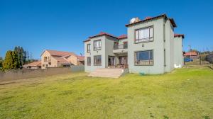 Inviting four bedroom three bathroom family gem with spacious yard in peaceful security estate. - M128761