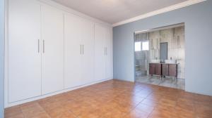 Inviting four bedroom three bathroom family gem with spacious yard in peaceful security estate. - M128761