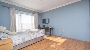 Inviting four bedroom three bathroom family gem with spacious yard in peaceful security estate. - M128761