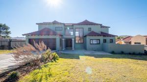 Inviting four bedroom three bathroom family gem with spacious yard in peaceful security estate. - M128761