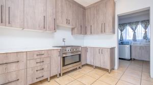 Inviting four bedroom three bathroom family gem with spacious yard in peaceful security estate. - M128761