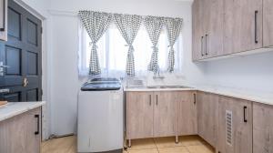 Inviting four bedroom three bathroom family gem with spacious yard in peaceful security estate. - M128761