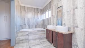 Inviting four bedroom three bathroom family gem with spacious yard in peaceful security estate. - M128761