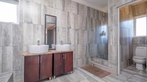 Inviting four bedroom three bathroom family gem with spacious yard in peaceful security estate. - M128761
