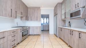 Inviting four bedroom three bathroom family gem with spacious yard in peaceful security estate. - M128761