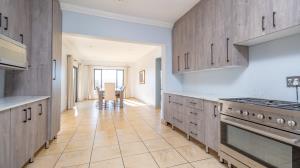 Inviting four bedroom three bathroom family gem with spacious yard in peaceful security estate. - M128761